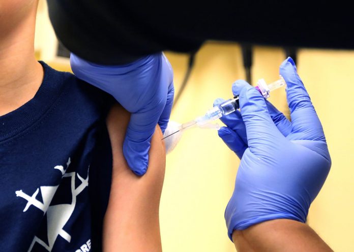 Massachusetts requires most students to get flu vaccine to ease burden on health system during pandemic