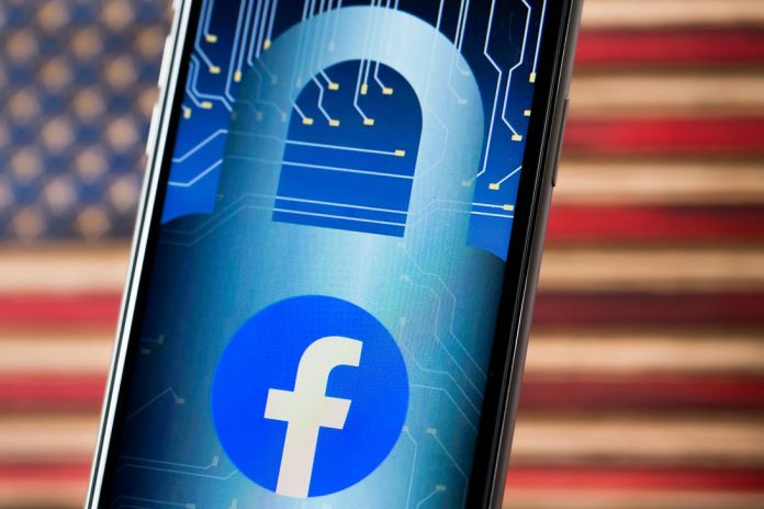 Facebook logo and padlock image on a phone screen.