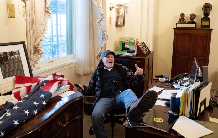 Man photographed with foot on Pelosi's desk during U.S. Capitol riot arrested