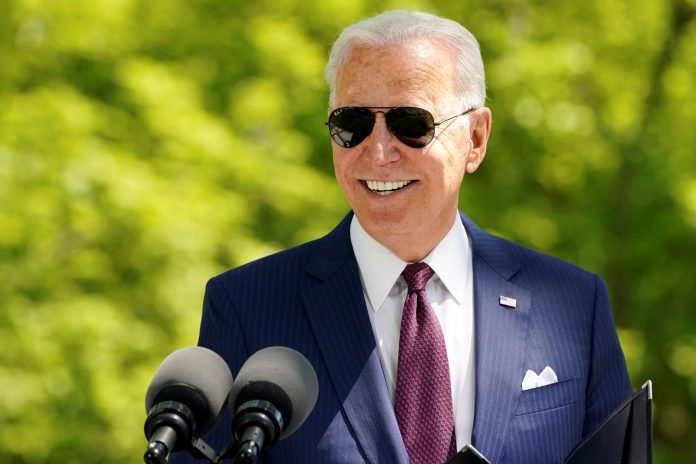 Americans support Biden's spending, want him to spend more, polls show