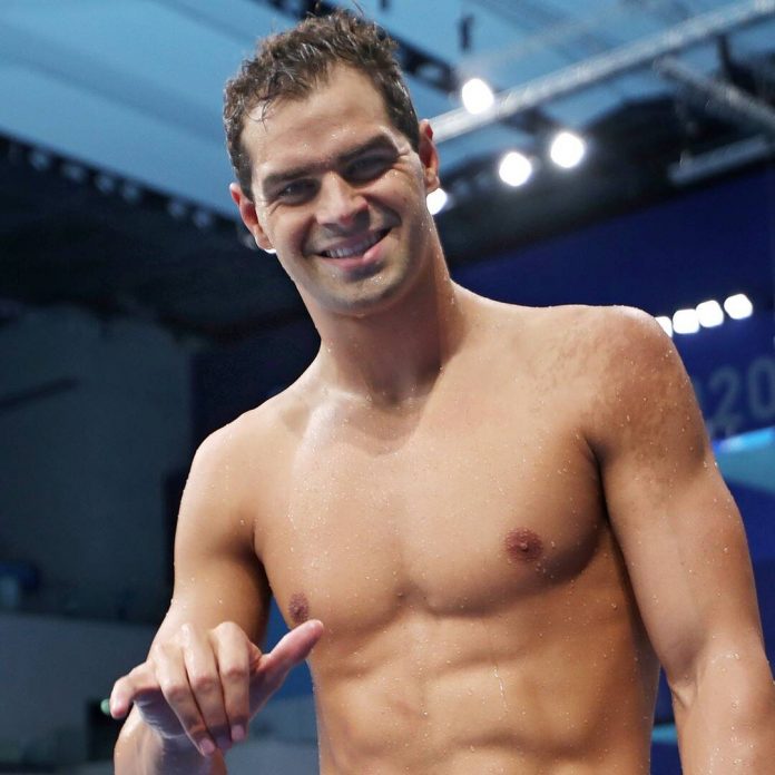 Olympic Committee Says Swimmer Didn't Violate Rules By Going Maskless - E! Online