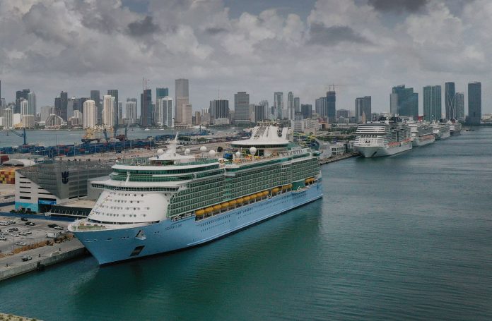 Royal Caribbean says 6 Covid cases discovered on board a ship; shares fall