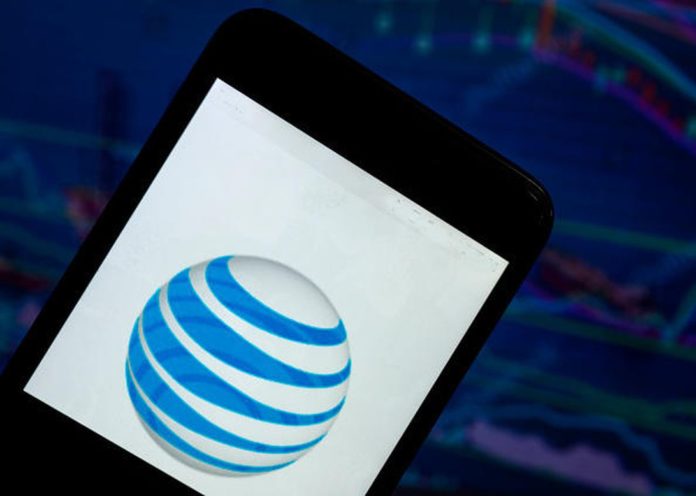 The AT&T logo seen displayed on a smart phone with a