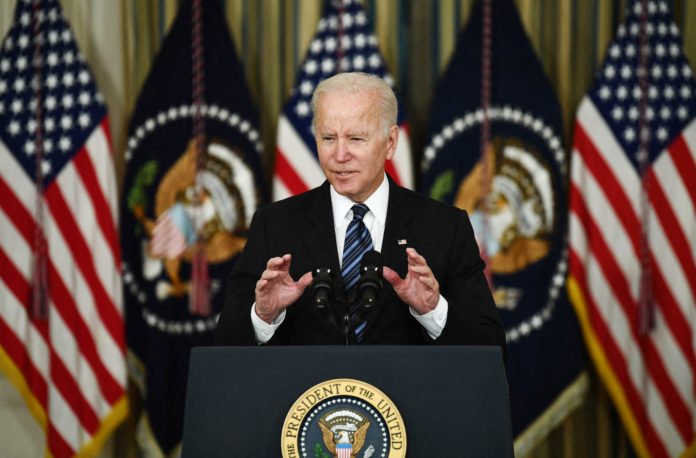 Biden lauds strong growth, pushes House to pass agenda