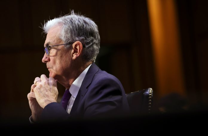 Fed Chair Powell says omicron variant poses risk to economy, complicates inflation
