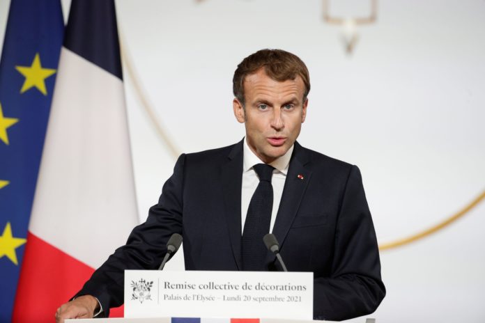 France's Macron extends booster shots, says will be required for health pass