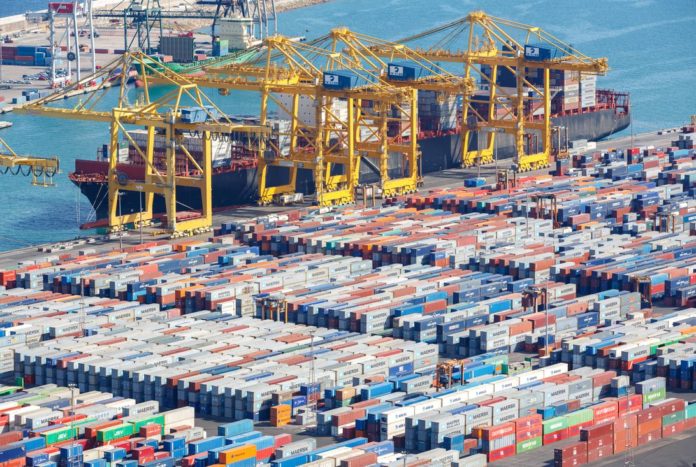 A colossal amount of cargo goes through the world's ports, like Barcelona's here in Spain, sent by standard-sized containers loaded on and off ships, trucks and trains. IBM and allies say their TradeLens blockchain-based network streamlines the paperwork.