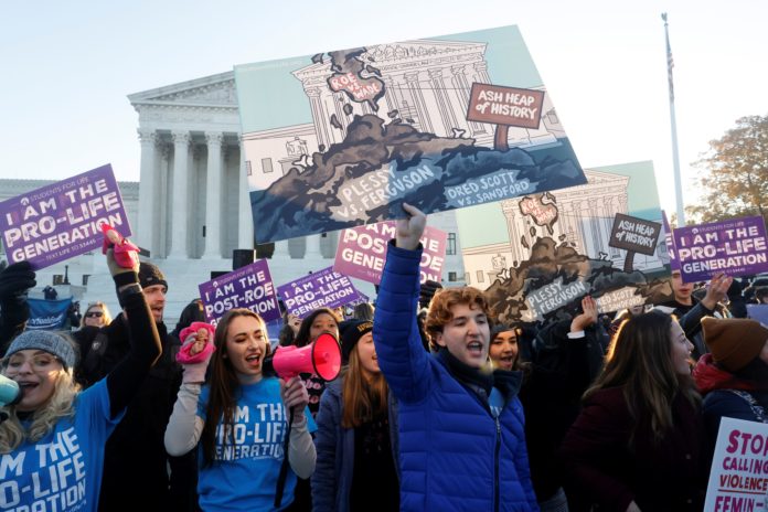 Supreme Court conservatives look poised to gut Roe v. Wade abortion rights