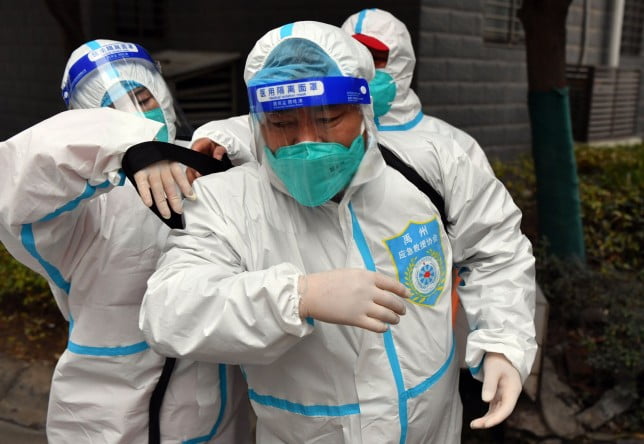 Mandatory Credit: Photo by Xinhua/REX/Shutterstock (12754822b) A medical worker gets equipped with disinfectant in Yuzhou City, central China's Henan Province, Jan. 10, 2022. Henan on Sunday reported 60 new locally transmitted COVID-19 cases, the National Health Commission said in its daily report on Monday. China Henan Covid 19 Prevention Control - 10 Jan 2022