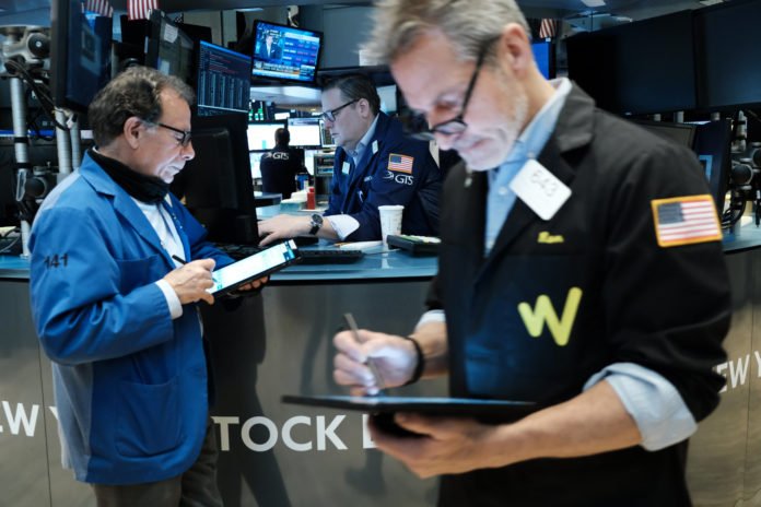 Stock futures dip as investors weigh earnings, Fed and geopolitics
