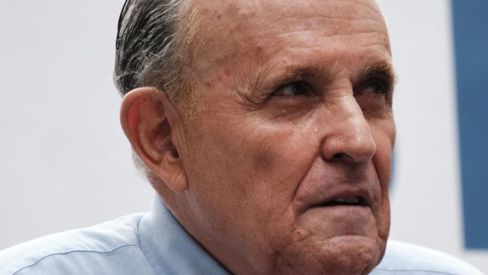 Man in custody after ex-NY mayor Giuliani 'slapped' on back, police say