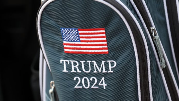 Son teases election run with golf bag at Saudi event