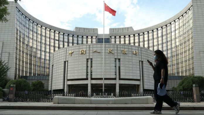 China central bank cuts 14-day reverse repo rate, steps up cash injections