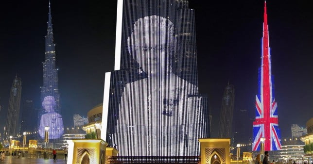 Queen's picture projected on World's tallest buildng in Dubai as monuments around the world are lit up in trubute Reuters|EPA
