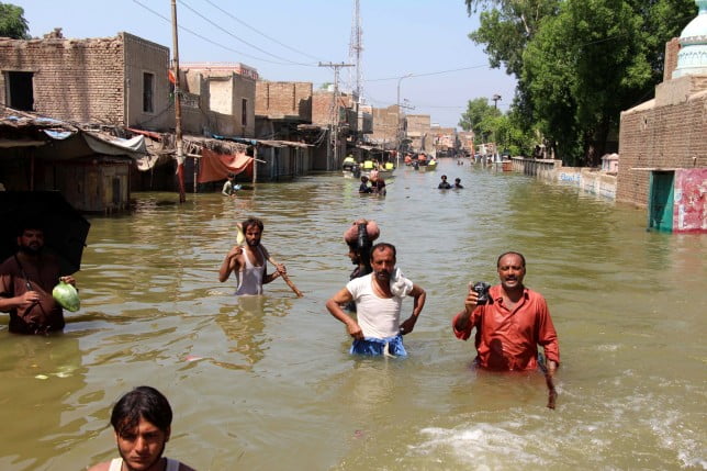 epa10155083 People affected by floods move to higher grounds in Khairpur Nathan Shah, Dadu district, Sindh province, Pakistan, 02 September 2022. According to the National Disaster Management Authority (NDMA) on 27 August, flash floods triggered by heavy monsoon rains have killed over 1,000 people across Pakistan since mid-June 2022. More than 33 million people have been affected by floods, the country's climate change minister said. EPA/WAQAR HUSSEIN