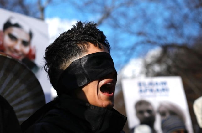 People protest against executions and detentions in Iran, in front of the Iranian Permanent Mission to the UN in New York City on December 17, 2022. (Photo by Kena Betancur / AFP) (Photo by KENA BETANCUR/AFP via Getty Images)