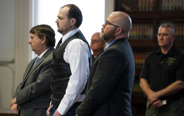 George Wagner IV, center, stands next to attorneys John P. Parker and Richard M. Nash while he receives his sentence from Judge Randy Deering at a hearing, Monday, Dec. 19, 2022, in Waverly, Ohio. Wagner who was convicted in the killings of eight members of an Ohio family was sentenced Monday to life in prison without the possibility of parole. (Brooke LaValley/The Columbus Dispatch via AP)