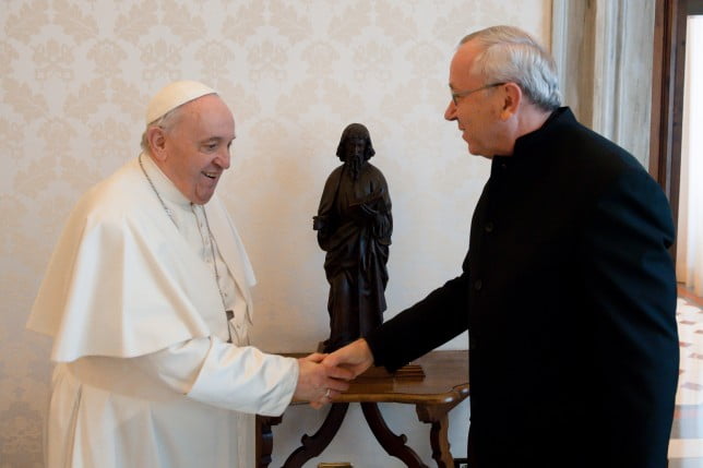 Pope Francis greets Jesuit Father Marko Rupnik during a private audience at the Vatican in this Jan. 3, 2022.