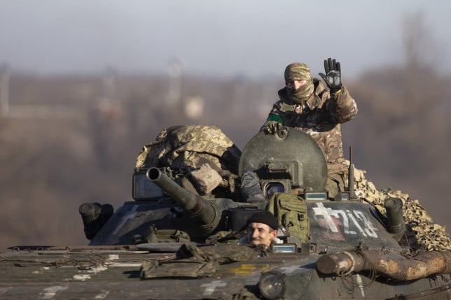 DONETSK OBLAST, UKRAINE - JANUARY 26: Ukrainian soldiers are seen on their ways to the frontlines with their armored military vehicles as the strikes continue on the Donbass frontline, during Russia and Ukraine war in Donetsk Oblast, Ukraine on January 26, 2023. (Photo by Mustafa Ciftci/Anadolu Agency via Getty Images)