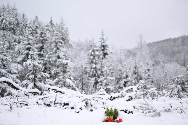 A makeshift memorial of flowers and candles is placed at the site where the body of a killed schoolgirl was found in Freudenberg, western Germany, on March 15, 2023. - Two schoolgirls have confessed to stabbing to death 12-year-old girl Luise, police said on March 14, 2023, in a case that has shocked the country. (Photo by INA FASSBENDER / AFP) (Photo by INA FASSBENDER/AFP via Getty Images)