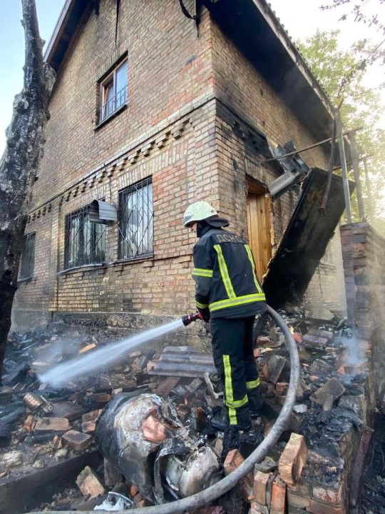 A firefighter works at a site of a private house damaged by remains of a cruise missile during a massive Russian air strike, amid Russia's attack on Ukraine, in Kyiv region, Ukraine May 29, 2023. Press service of the State Emergency Service of Ukraine in Kyiv region/Handout via REUTERS ATTENTION EDITORS - THIS IMAGE HAS BEEN SUPPLIED BY A THIRD PARTY. DO NOT OBSCURE LOGO.