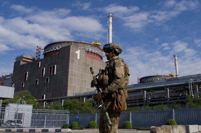 A Russian serviceman patrols the territory of the Zaporizhzhia Nuclear Power Station in Energodar on May 1, 2022. - The Zaporizhzhia Nuclear Power Station in southeastern Ukraine is the largest nuclear power plant in Europe and among the 10 largest in the world. (Photo by Andrey BORODULIN / AFP) (Photo by ANDREY BORODULIN/AFP via Getty Images)