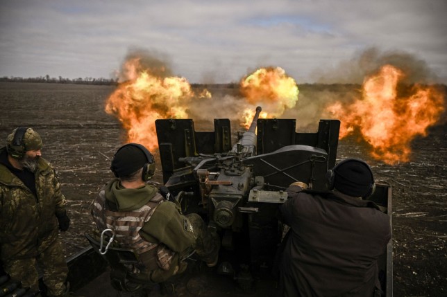 TOPSHOT - Ukrainian servicemen fire with a S60 anti-aircraft gun at Russian positions near Bachmut on March 20, 2023, amid the Russian invasion of Ukraine. (Photo by Aris Messinis / AFP) (Photo by ARIS MESSINIS/AFP via Getty Images)