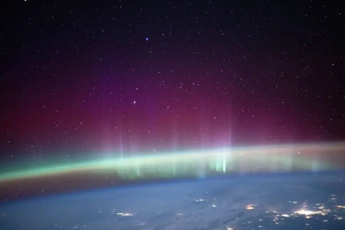An Aurora Intersects Earth’s Airglow Beneath a Starry Sky